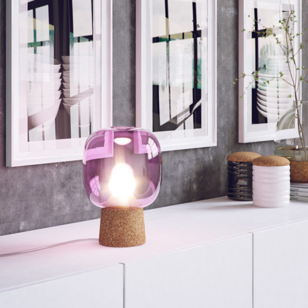 Picia table lamp designed by Enrico Zanolla in purple glass and natural cork on a white side desk emphasizes the beauty of your living room